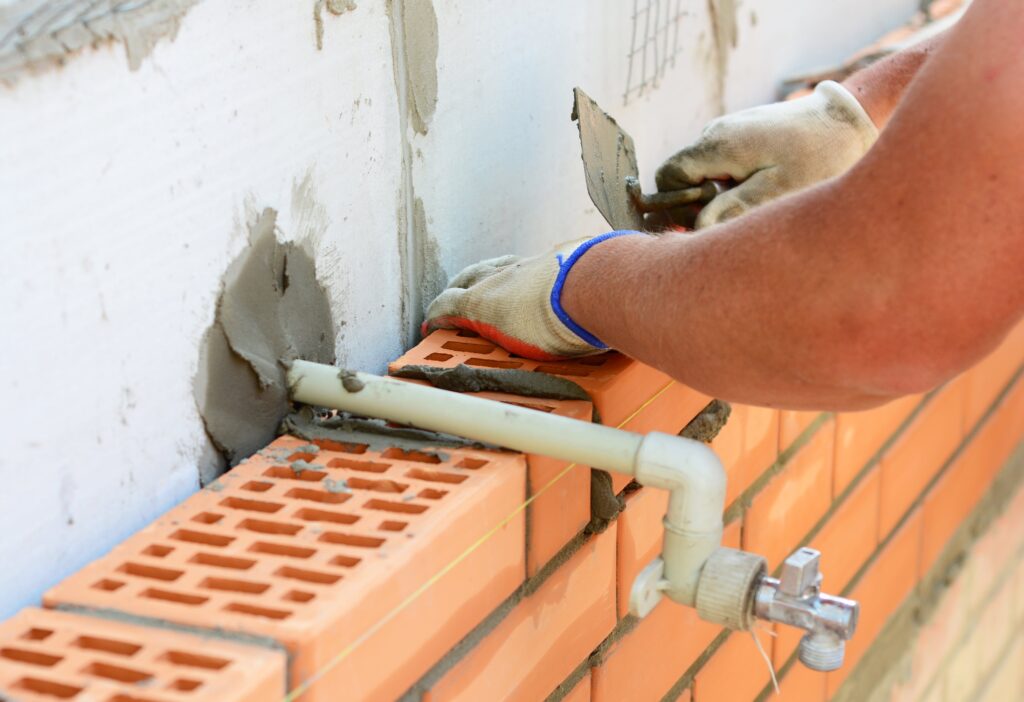 plumber fixing a pipe