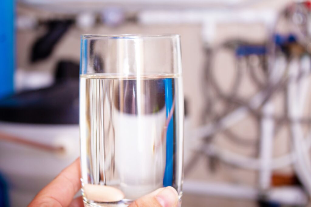 bigstock-Clean-Water-Glass-In-Hand-Wat-432407402-min