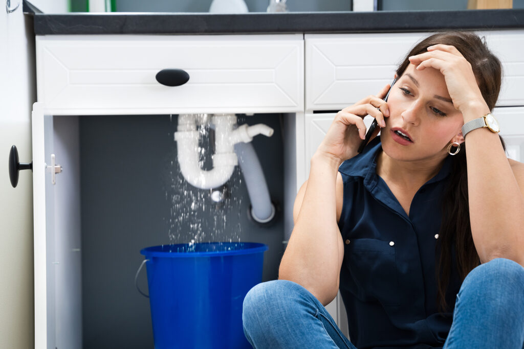 Sink pipe water leak plumbing damage at home